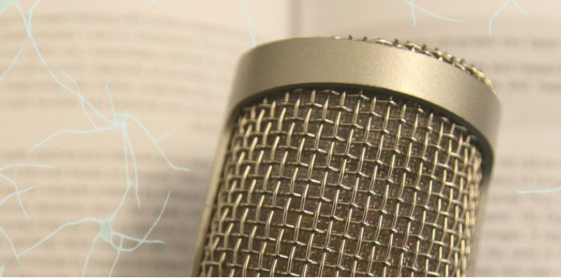 A microphone overlaid by an illustration of a neural network